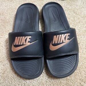 Nike Black Slides with Gold Logo
